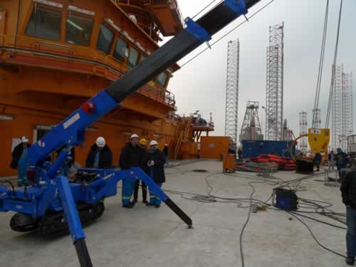 Our KB3.0 mini crawler crane is on a large ship deck.
